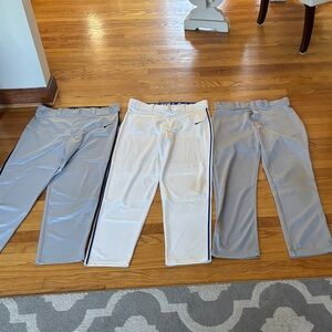 3 pairs of men’s size M Baseball Pants. 2 Nike Swingman (gray & white) 1 Wilson